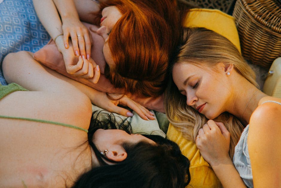 Three women peacefully resting together, embodying friendship and relaxation.